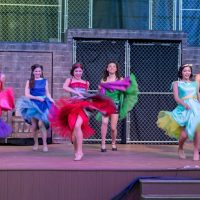 Community Theatre actors dancing in Leawood Stage Company's free summer production of the musical West Side Story